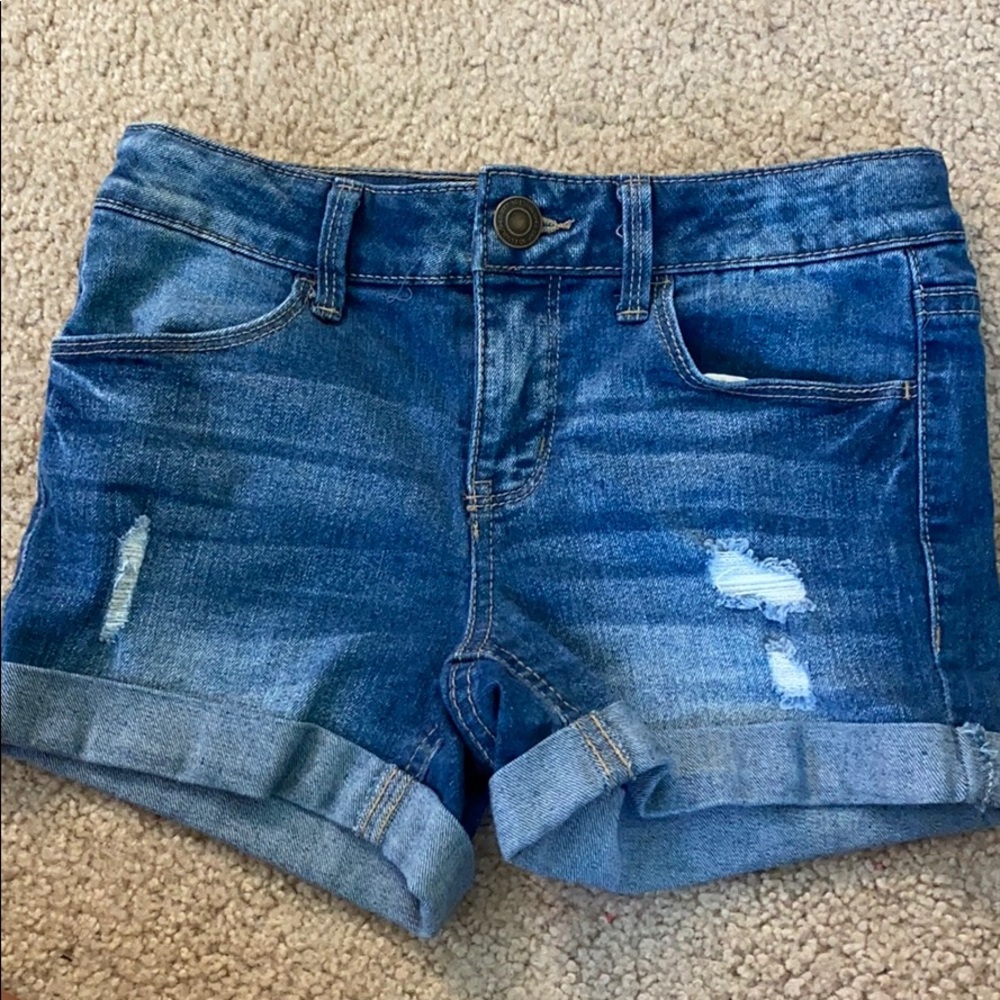 ripped blue jean shorts